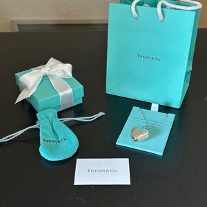 Tiffany & Co. Sterling Silver Heart Locket Pendant with Tiffany Chain Necklace.